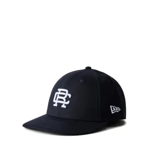 REIGNING CHAMP X NEW ERA LOW PRO 59FIFTY MONOGRAM CAP